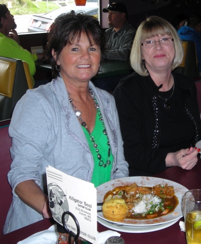 Karen and Denise- eating GREAT soul food and drinking beer! Are they old enough?